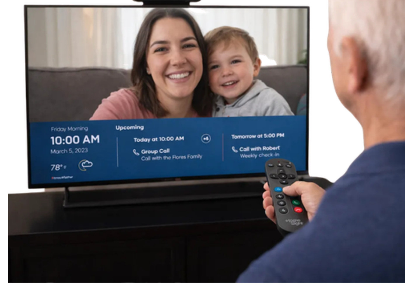 A senior video calling family on their TV through HomeTogether